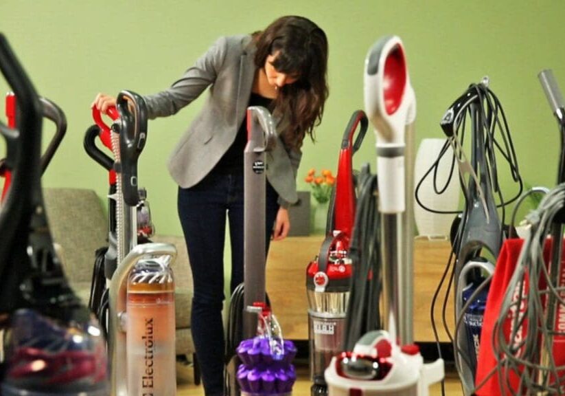 A woman is looking at many different items.